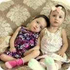 Сестры Омаровы получили кресло и коляску